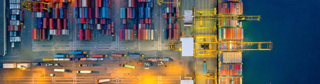 headers_0006_orig-working-crane-bridg-loading-cargo-on-ship-Getty-852960022