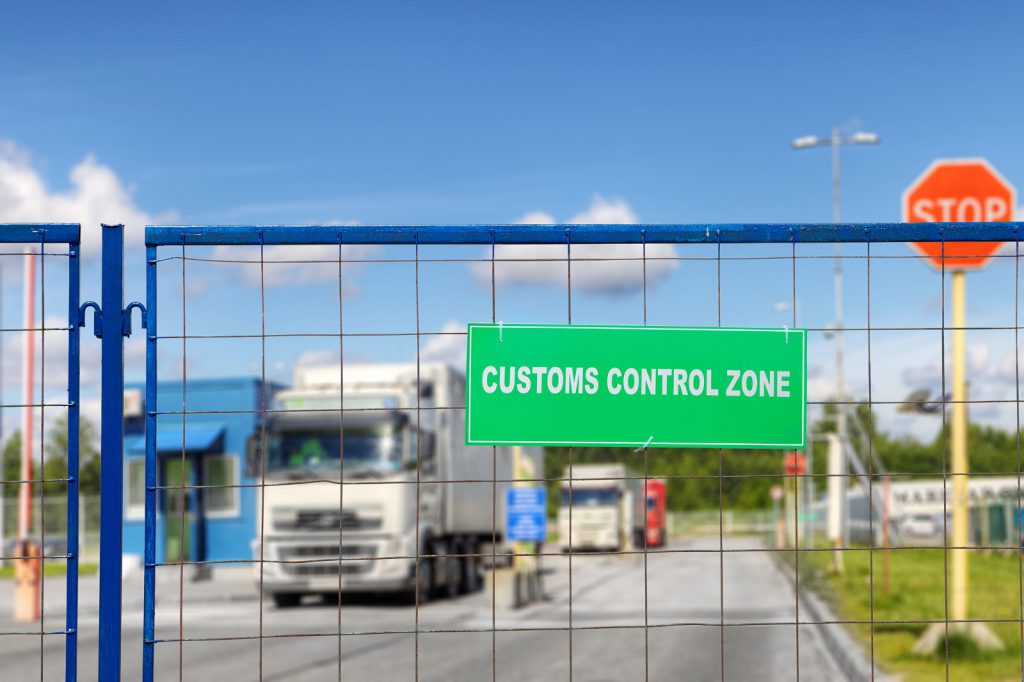 Lorries pass through checkpoint of logistics complex with customs services. SGS Achieves HMRC Excise Registered Consignor Status